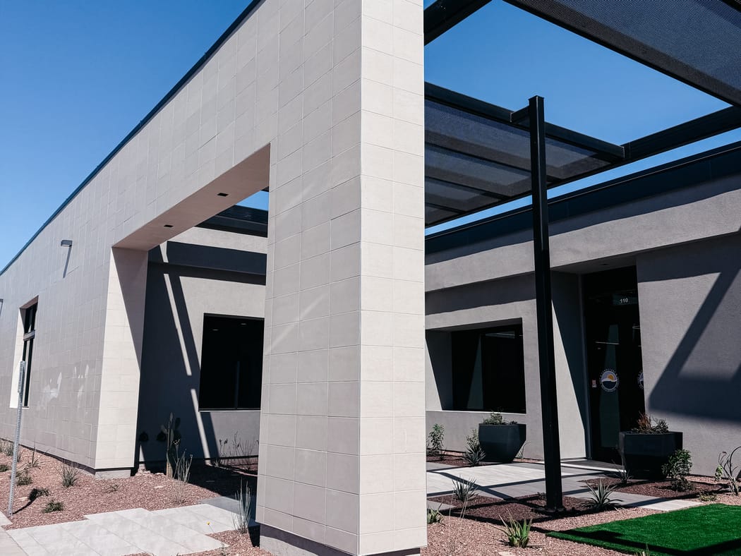 Office entrance to sandstone oms