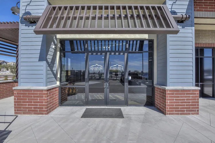 Office entrance to sandstone oms