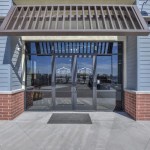 Office entrance to sandstone oms